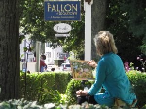 Marilyn Simandle painting on Saturday, September 7, 2013 across the street from The Christina Gallery and in the gardens of The Fallon.