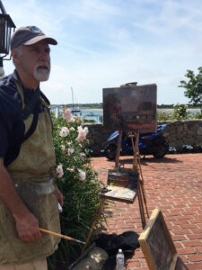 John painting on North Water Street